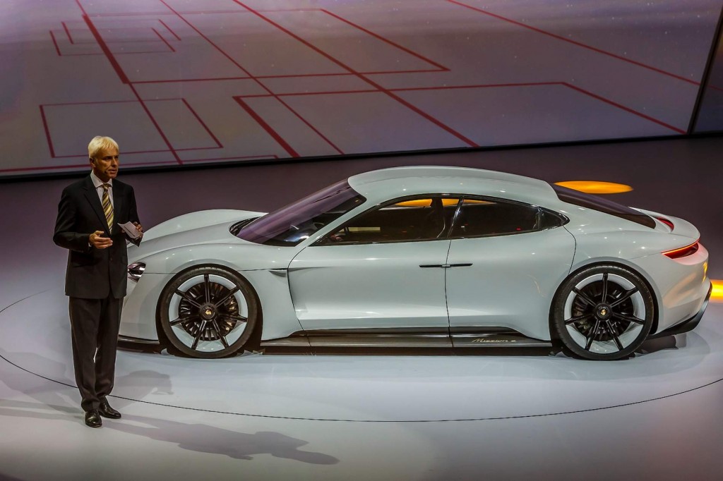 wolfgang hatz porsche presenting mission E model